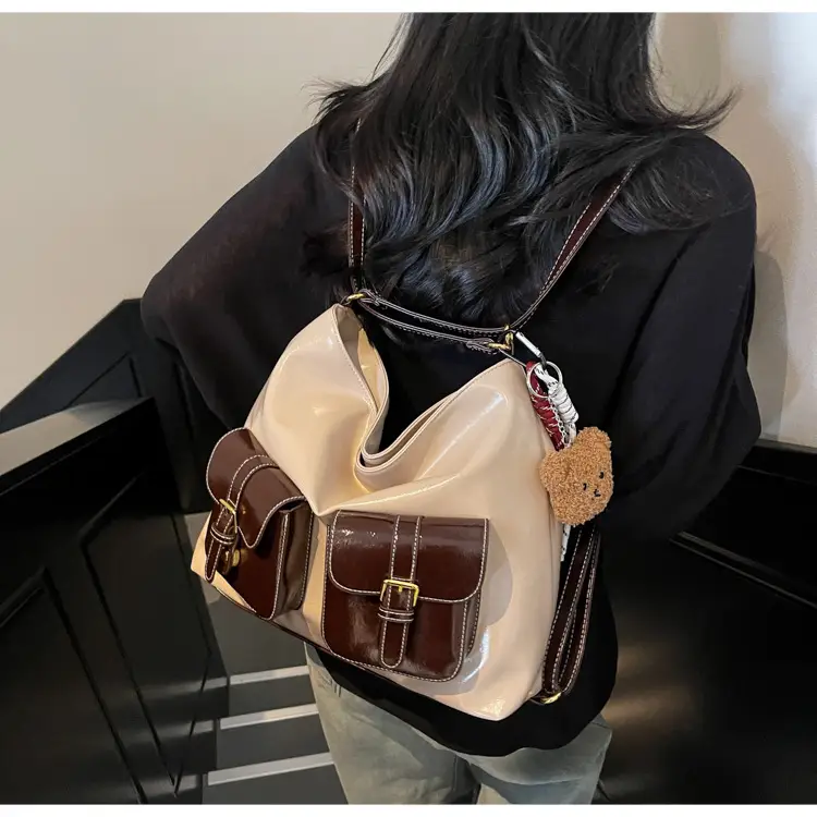 Black Leather Crossbody Bag with Gold Clasp & Teddy Keychain — feature 23