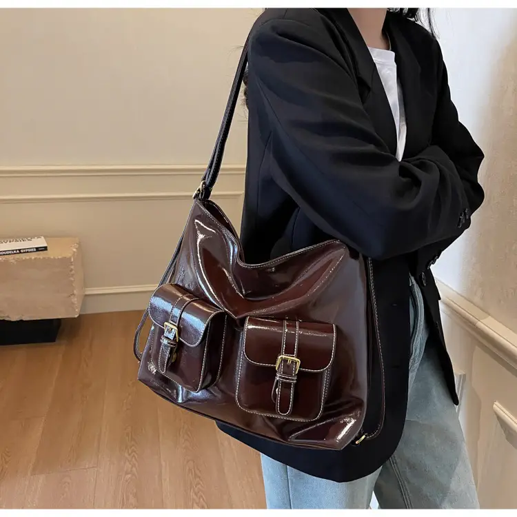 Black Leather Crossbody Bag with Gold Clasp & Teddy Keychain — feature 25