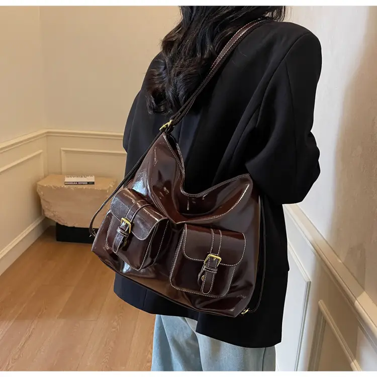 Black Leather Crossbody Bag with Gold Clasp & Teddy Keychain — feature 26