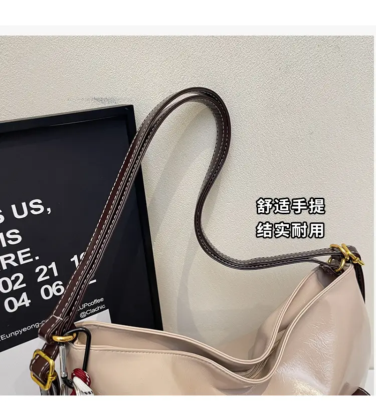 Black Leather Crossbody Bag with Gold Clasp & Teddy Keychain — feature 5