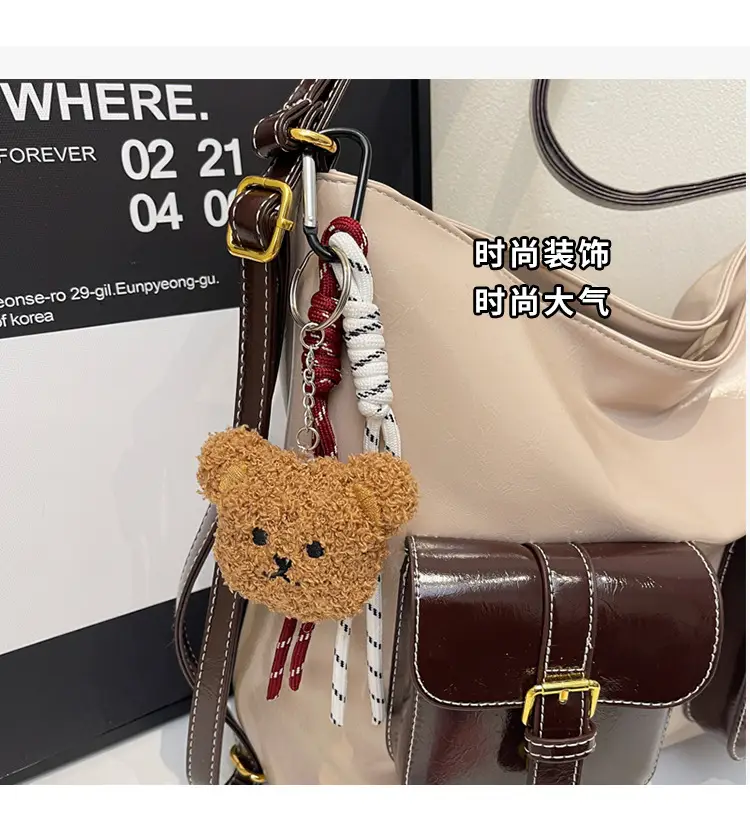 Black Leather Crossbody Bag with Gold Clasp & Teddy Keychain — feature 7