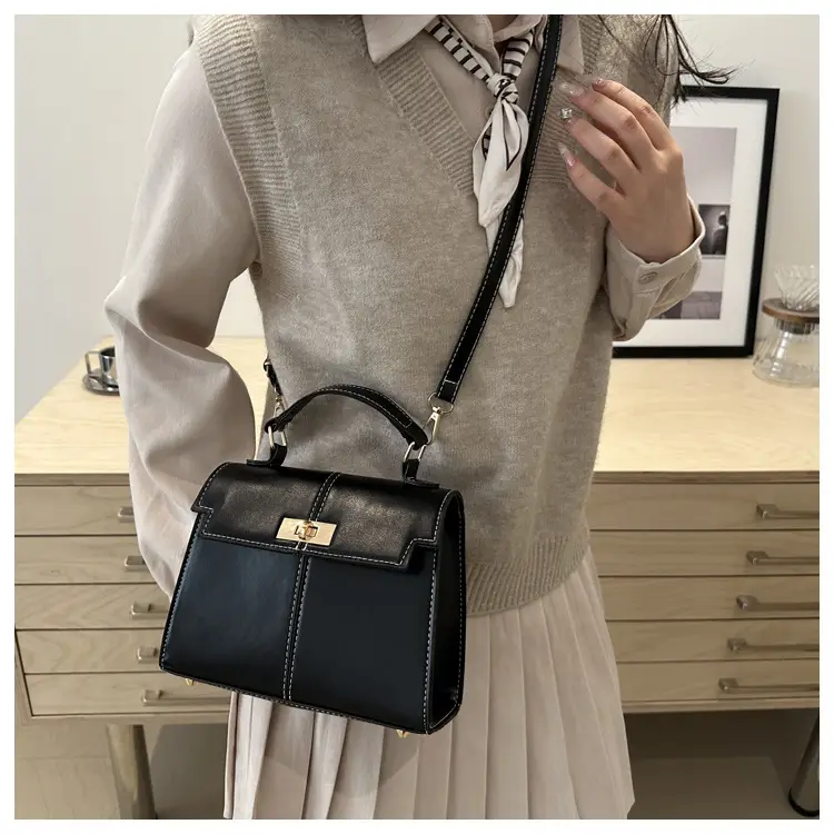 Black Leather Shoulder Bag with Gold Clasp 2025 — feature 16