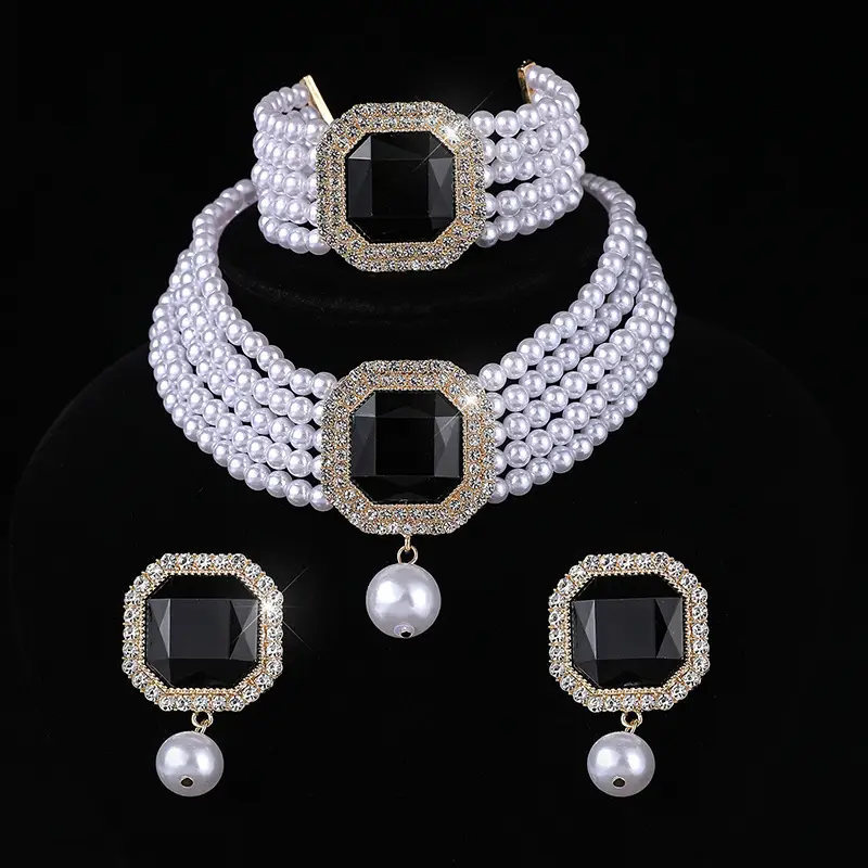 Three-piece Bridal Jewelry Set with Emerald Cufflures and Pearl Accents - Image 10