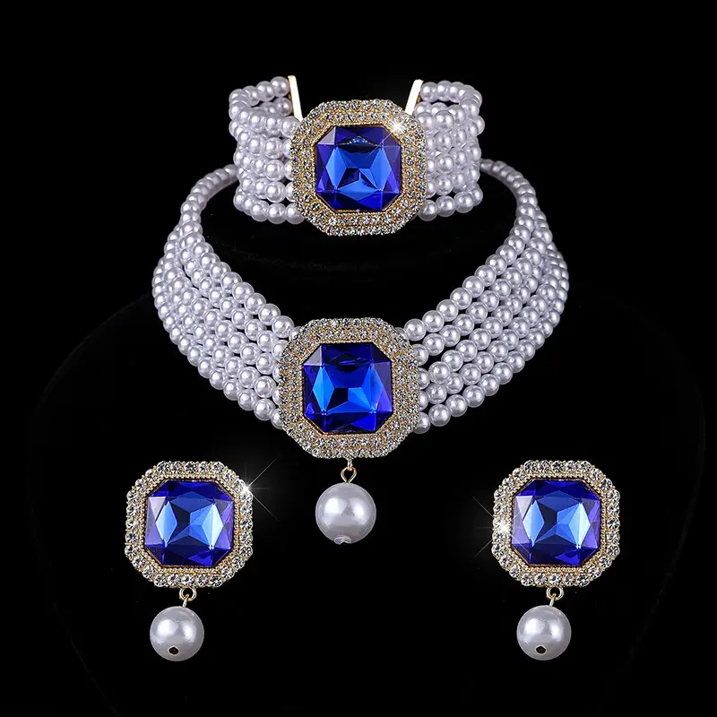 Three-piece Bridal Jewelry Set with Emerald Cufflures and Pearl Accents - Image 8