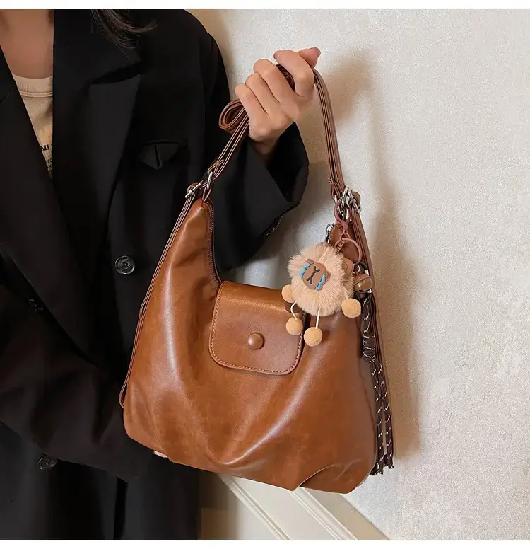 Women's Brown Leather Tote Bag with Pom Pom Charm — feature 29