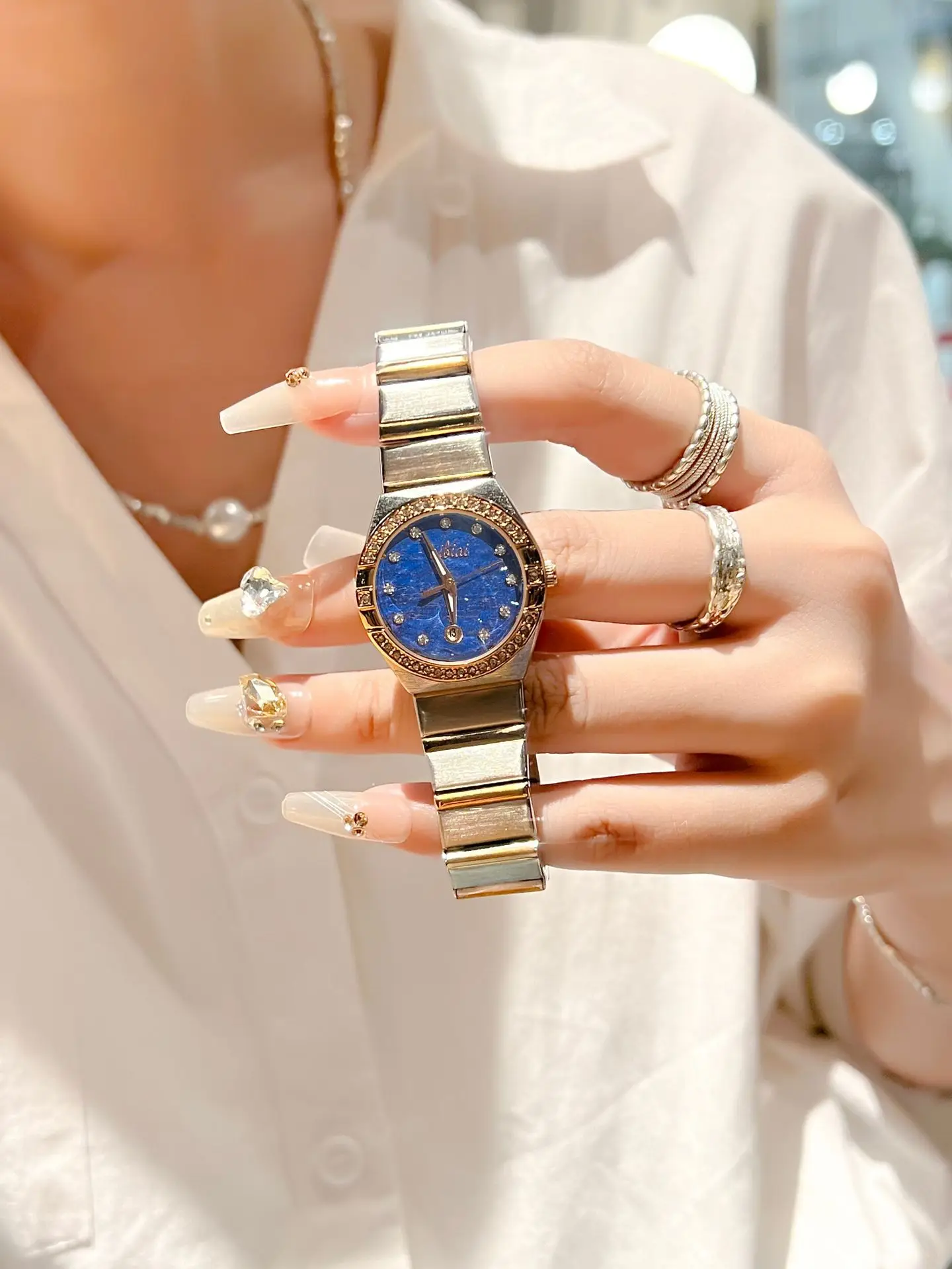 Women's Cross-Brand Diamond Watch with Log Steel Band — feature 6