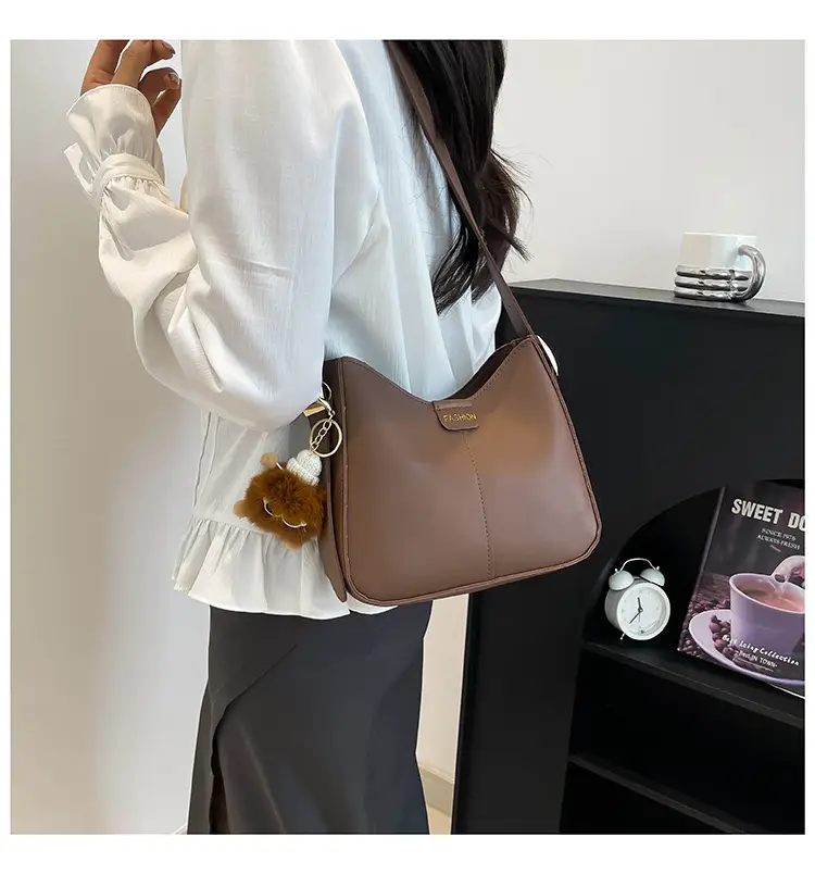 Brown Western Style Crossbody Bag with Pom Pom — feature 17
