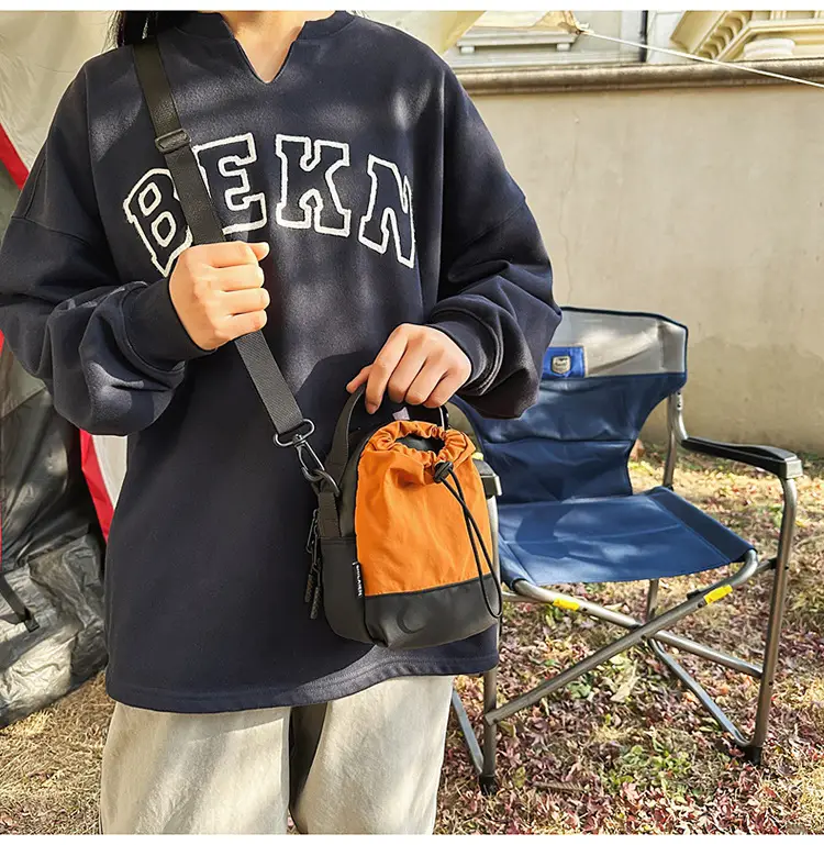 Men Orange Drawstring Phone Bag with Crossbody Strap — feature 21