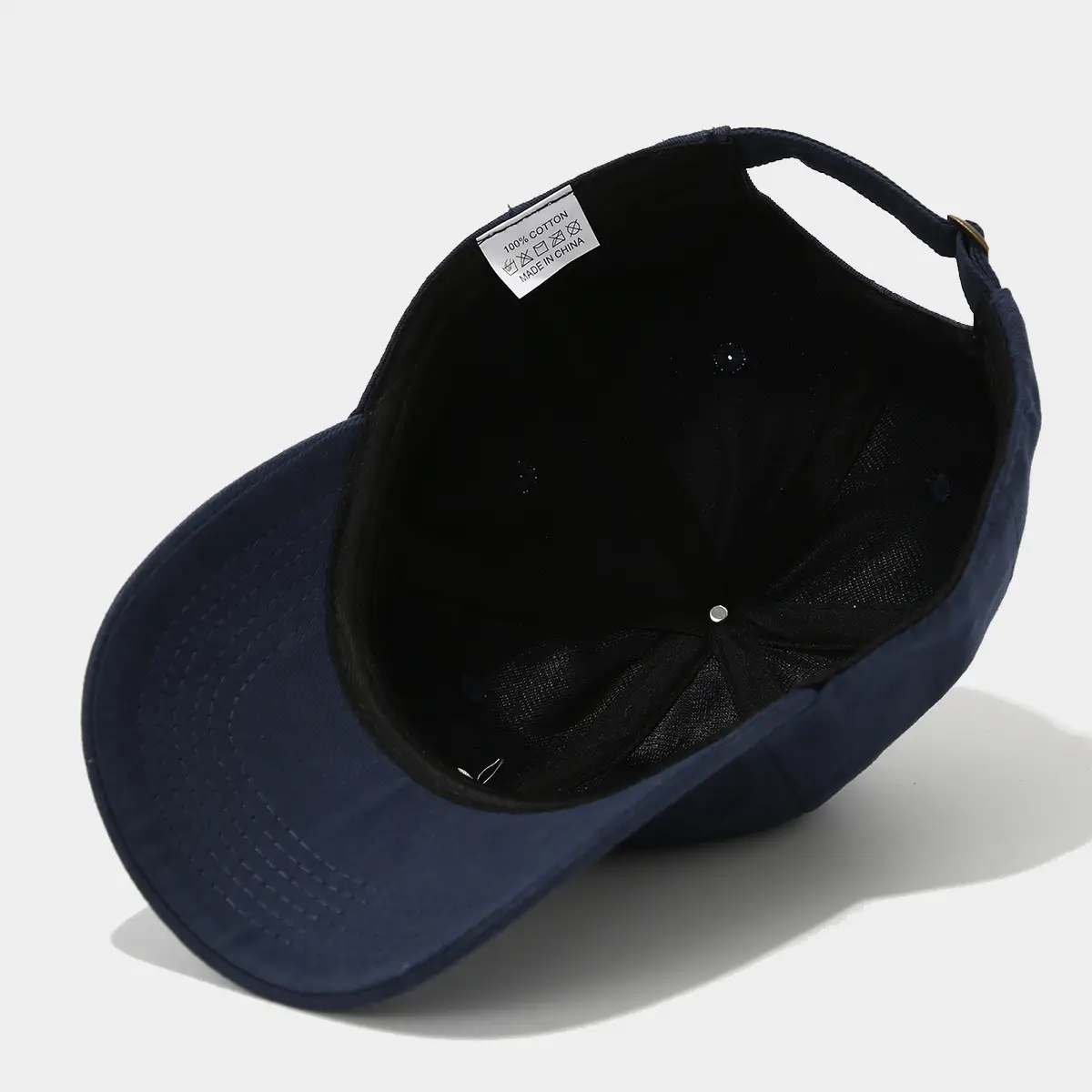 Black Baseball Cap with Embroidered Face Design — feature 13