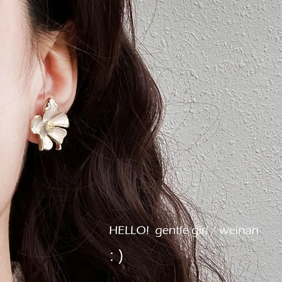 Milk White Floral Stud Earrings with Glaze Finish — feature 2
