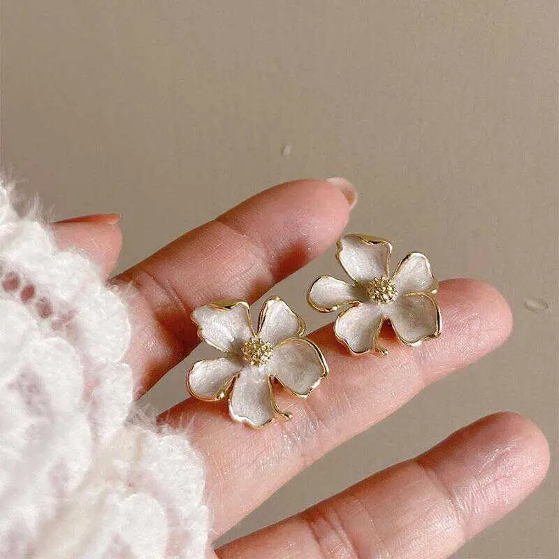 Milk White Floral Stud Earrings with Glaze Finish — feature 3