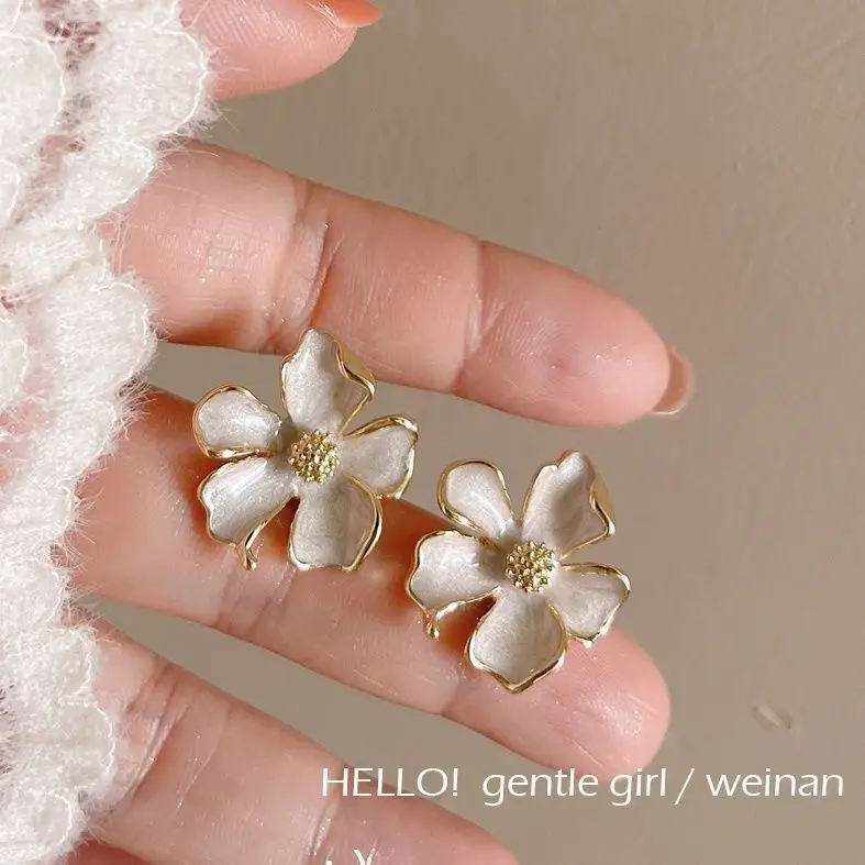 Milk White Floral Stud Earrings with Glaze Finish — feature 4