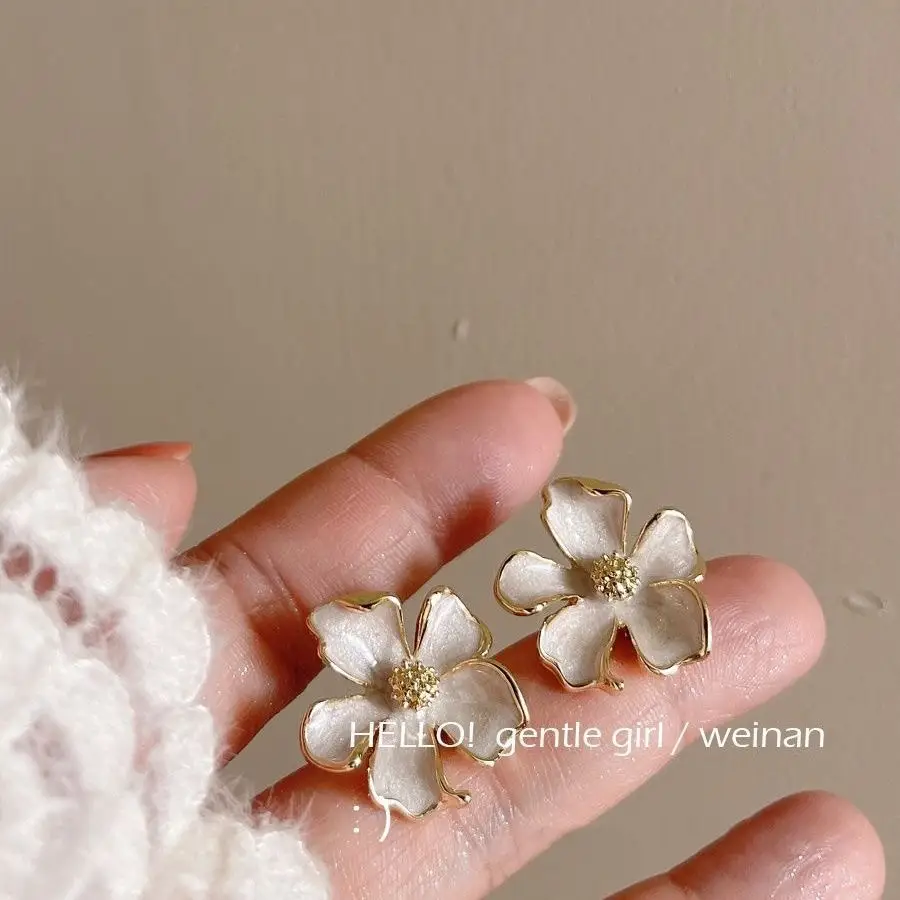 Milk White Floral Stud Earrings with Glaze Finish — feature 5