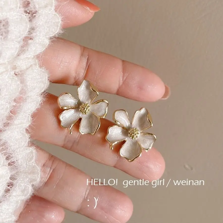 Milk White Floral Stud Earrings with Glaze Finish — feature 6