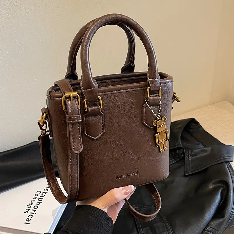 Women's Brown Crossbody Bag with Doll Pendant - Image 6