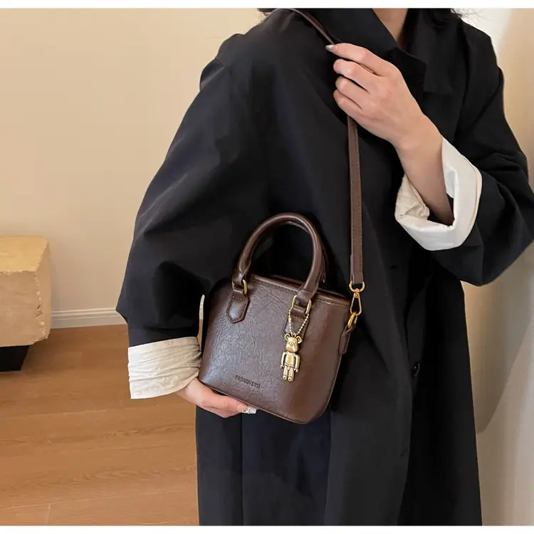 Women's Brown Crossbody Bag with Doll Pendant — feature 17