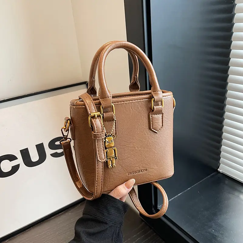 Women's Brown Crossbody Bag with Doll Pendant - Image 3
