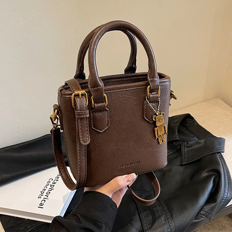 Women's Brown Crossbody Bag with Doll Pendant - Image 4