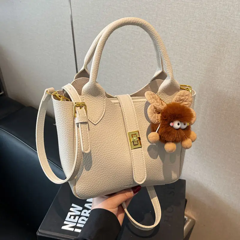 Women's White Leather Bucket Bag with Cute Pom Pom Charm - Image 7