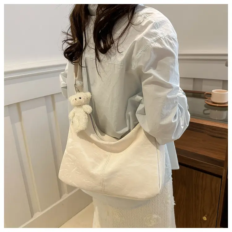 2024 Soft Puffer Shoulder Bag with Teddy Bear Pendant — feature 12