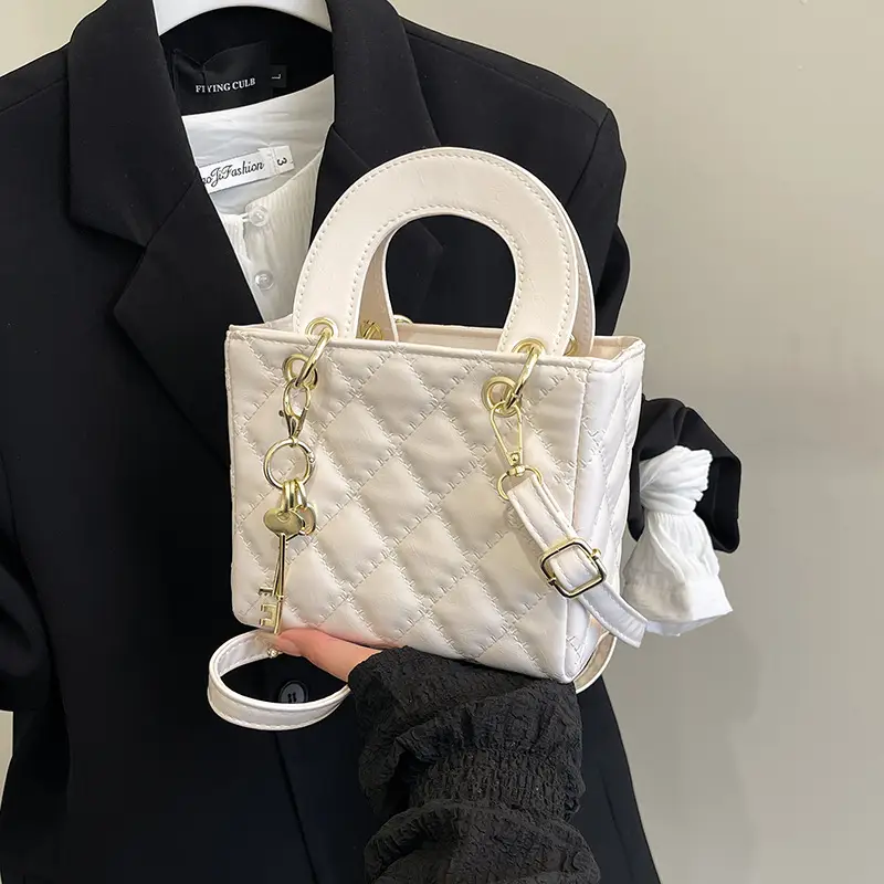 White Quilted Handbag with Gold Chain & Bow - Image 10