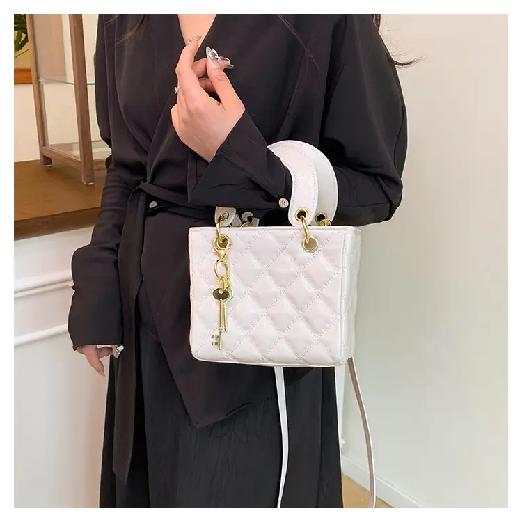 White Quilted Handbag with Gold Chain & Bow — feature 12