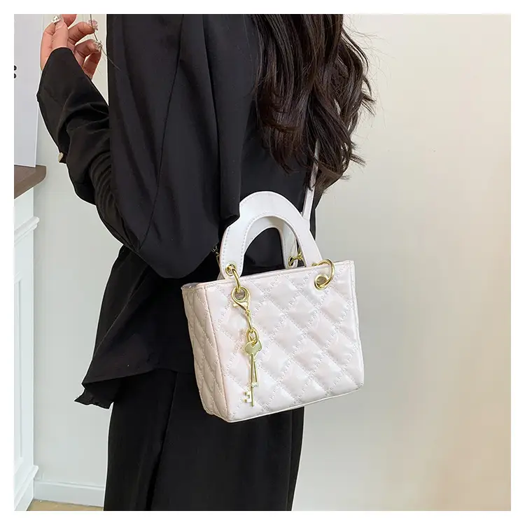 White Quilted Handbag with Gold Chain & Bow — feature 13