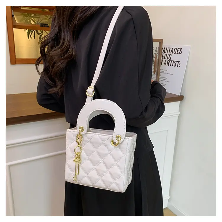 White Quilted Handbag with Gold Chain & Bow — feature 15