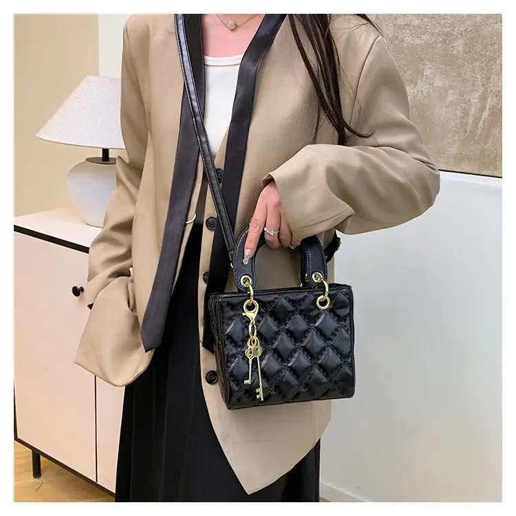 White Quilted Handbag with Gold Chain & Bow — feature 16