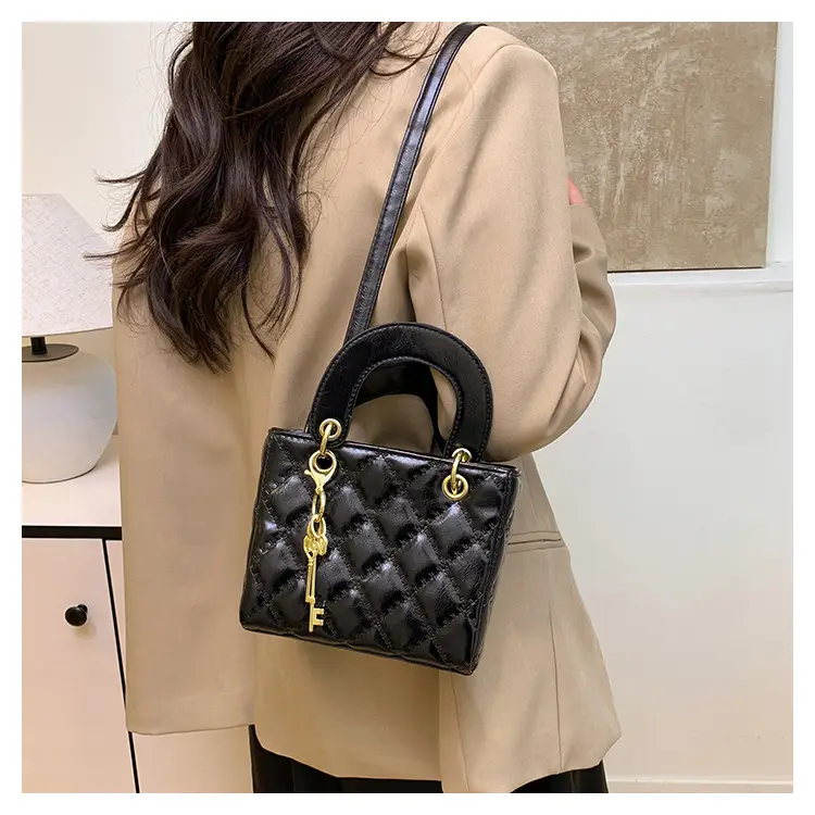 White Quilted Handbag with Gold Chain & Bow — feature 18