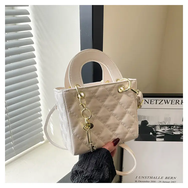 White Quilted Handbag with Gold Chain & Bow — feature 22