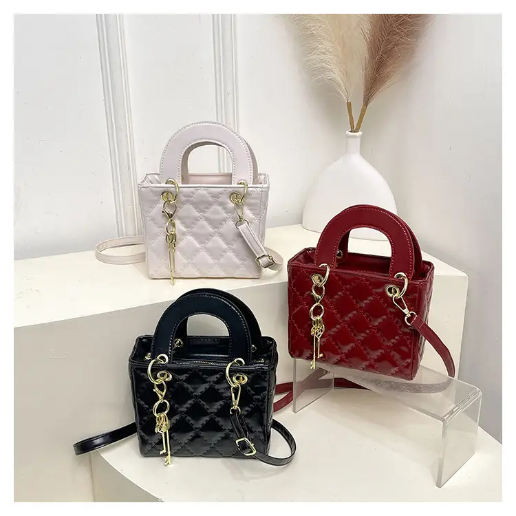 White Quilted Handbag with Gold Chain & Bow — feature 26