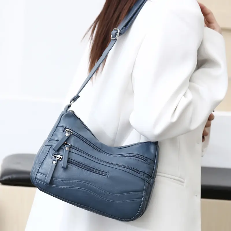 Black Leather Crossbody Bag with Multiple Compartments - Image 3