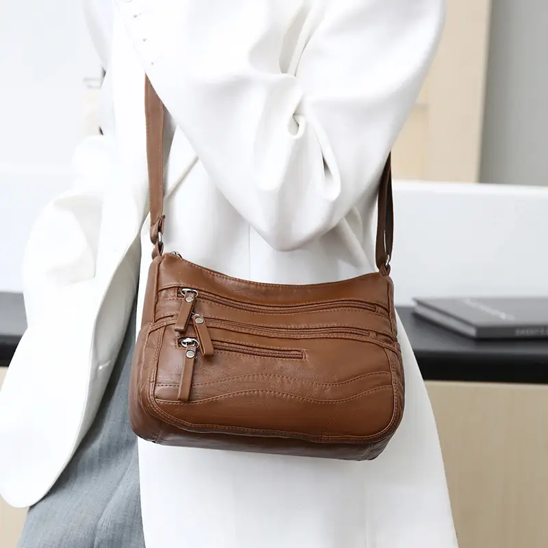 Black Leather Crossbody Bag with Multiple Compartments - Image 4
