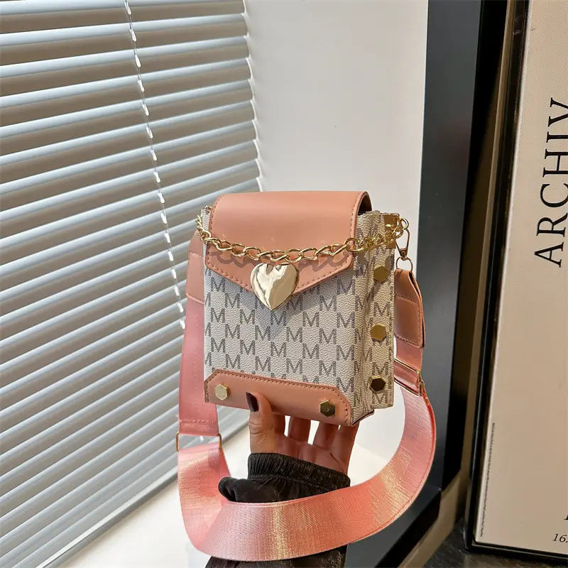 Women's tan chain strap shoulder bag with monogram pattern - Image 7