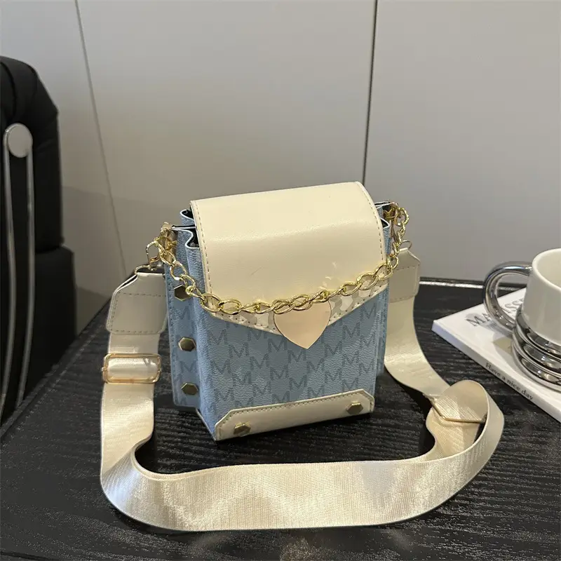 Women's tan chain strap shoulder bag with monogram pattern - Image 8