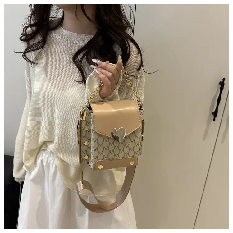 Women's tan chain strap shoulder bag with monogram pattern — feature 14