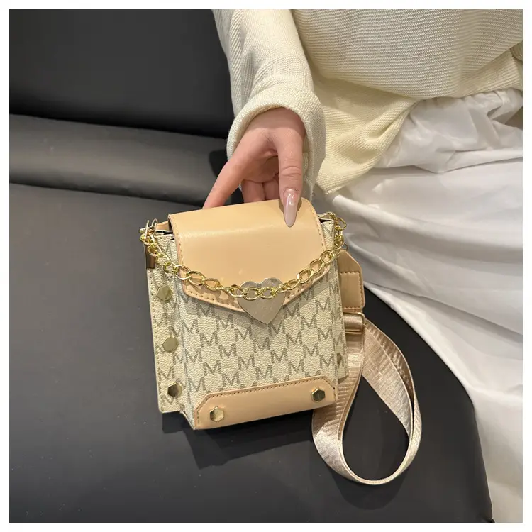 Women's tan chain strap shoulder bag with monogram pattern — feature 15