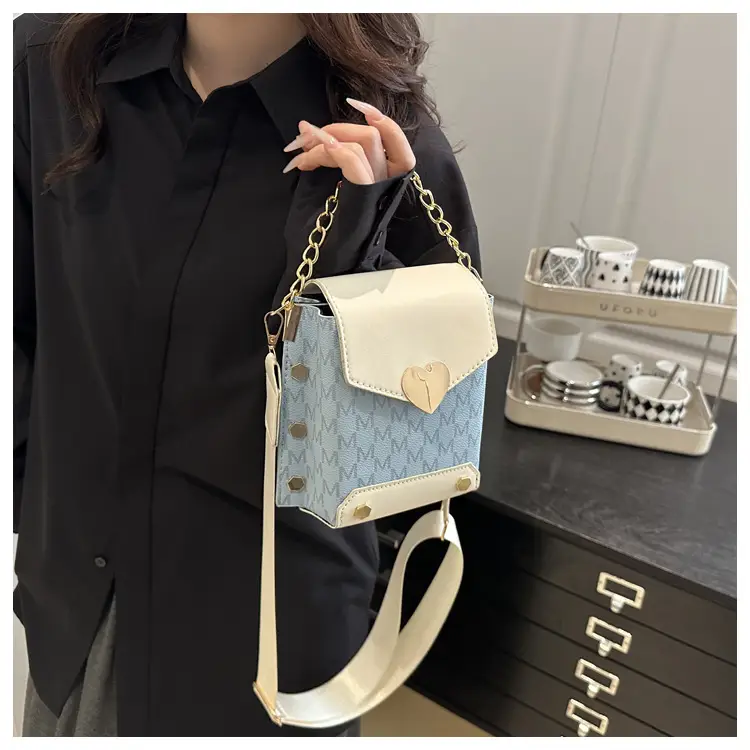 Women's tan chain strap shoulder bag with monogram pattern — feature 20