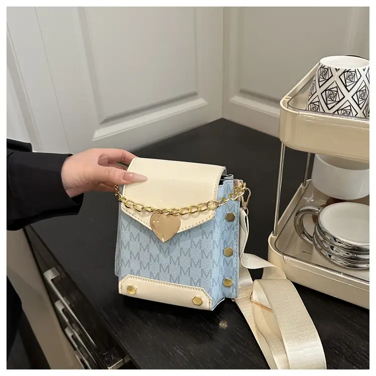 Women's tan chain strap shoulder bag with monogram pattern — feature 21