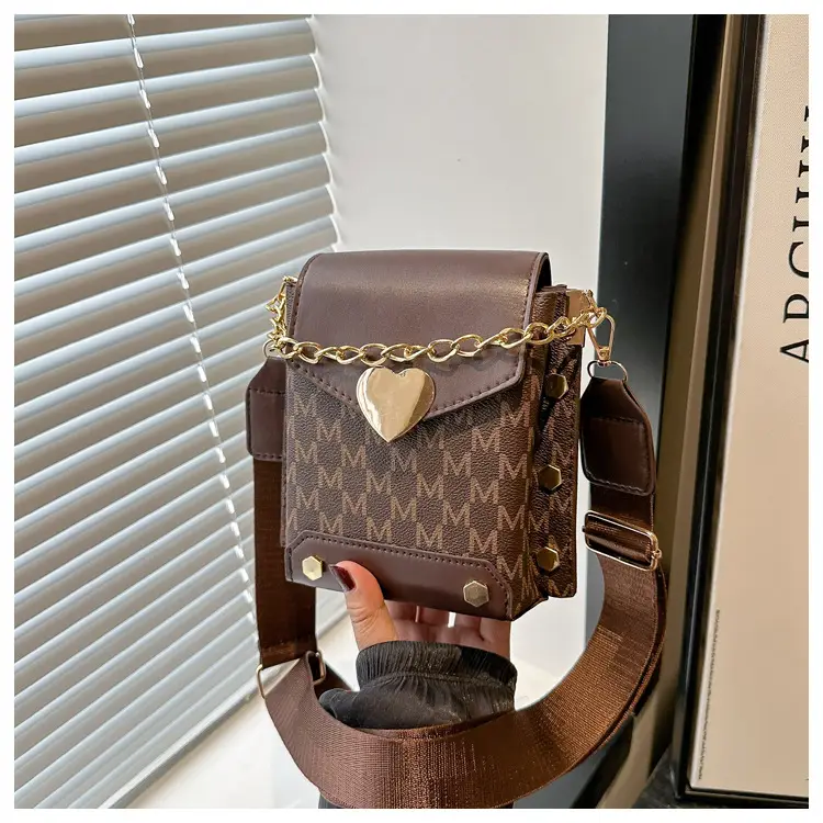 Women's tan chain strap shoulder bag with monogram pattern — feature 26