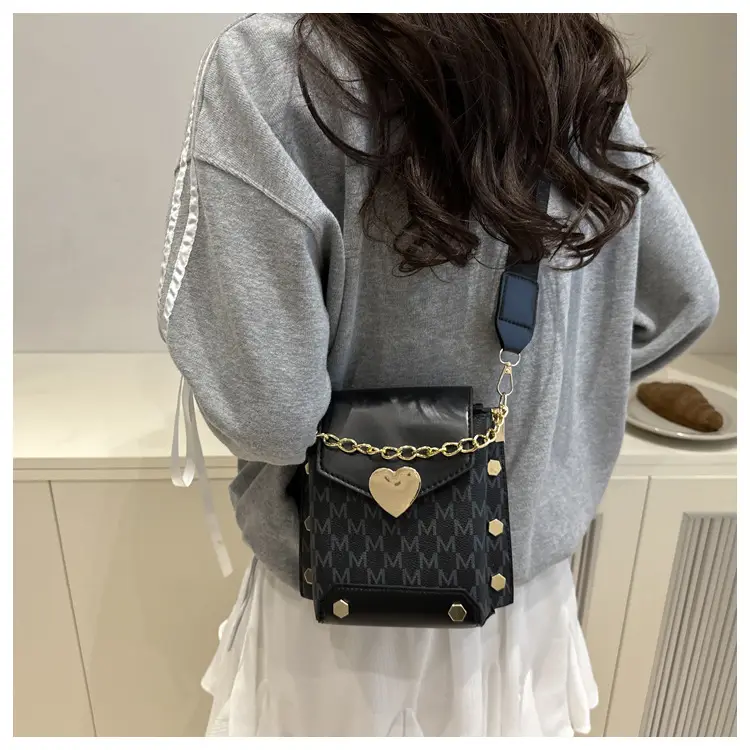 Women's tan chain strap shoulder bag with monogram pattern — feature 7