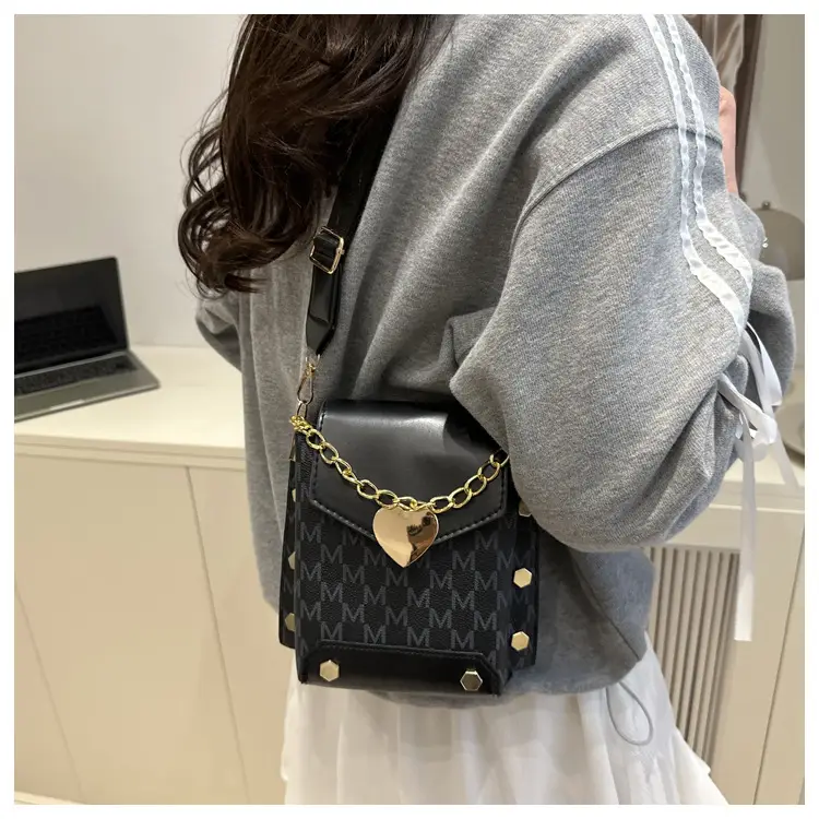Women's tan chain strap shoulder bag with monogram pattern — feature 9