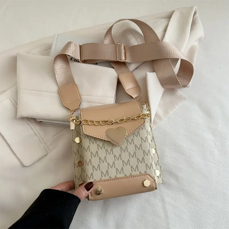Women's tan chain strap shoulder bag with monogram pattern - Image 2
