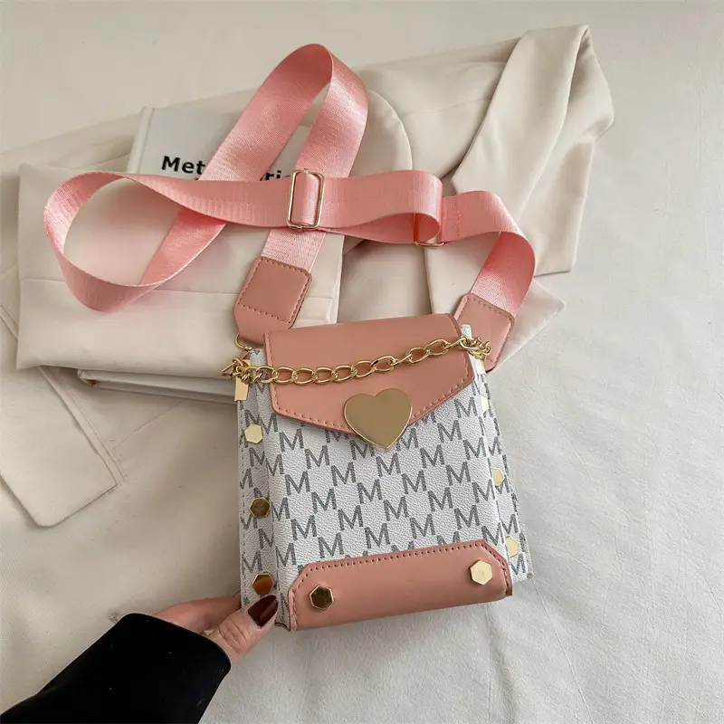 Women's tan chain strap shoulder bag with monogram pattern - Image 3