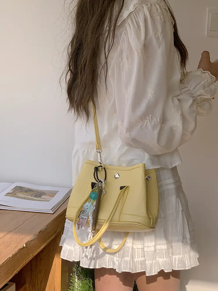 Women's Yellow Leather Bucket Bag Spring 2025 — feature 8