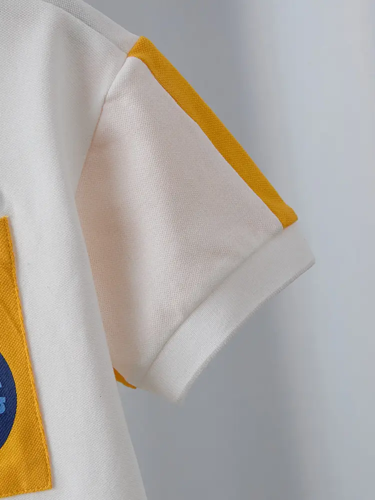 Boys White Polo Shirt with Yellow Sleeve Straps — feature 27