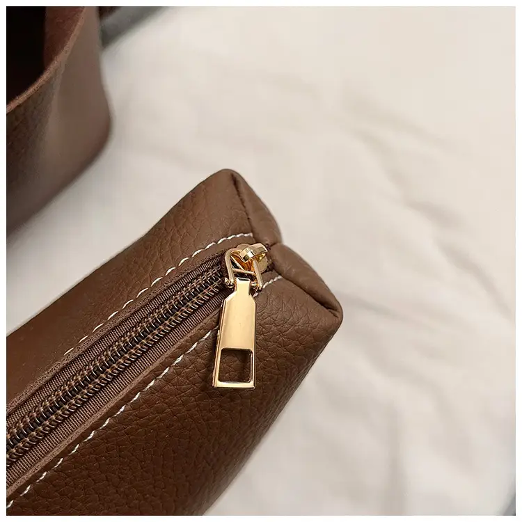 Stylish Brown Leather Handbag with Logo Print — feature 12