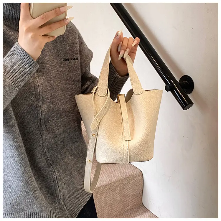 Stylish Brown Leather Handbag with Logo Print — feature 2