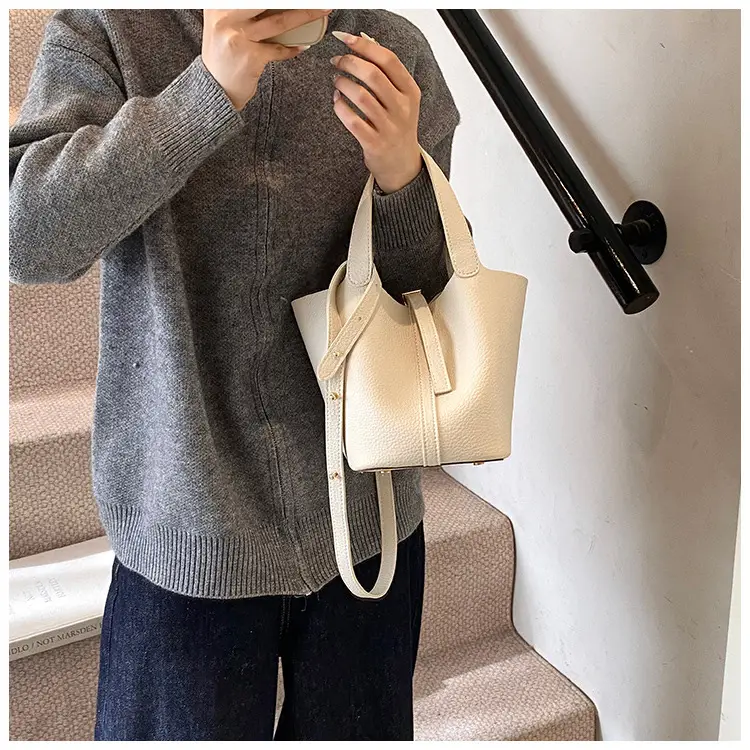 Stylish Brown Leather Handbag with Logo Print — feature 3